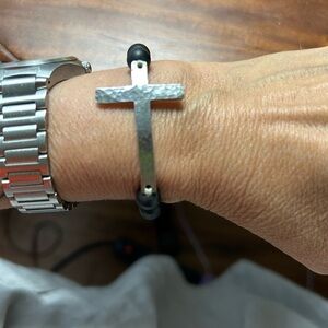 Beautiful hammered Sterling cross bracelet with black beads. Stretchy